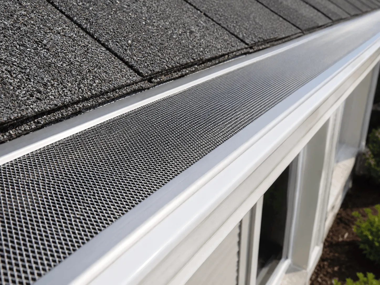 Close view of fine stainless micro-mesh over a gutter
